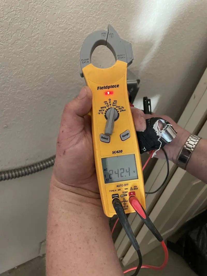 Voltage testing with clamp meter during Electrical Installation Services in Romeoville